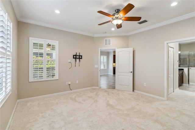 4891 Maymont Park Cir, Bradenton, FL 34203 - unfurnished bedroom with ceiling fan, multiple windows, ensuite bathroom, ornamental molding, and light carpet