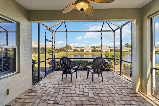 4891 Maymont Park Cir, Bradenton, FL 34203 - sunroom / solarium featuring ceiling fan and a water view