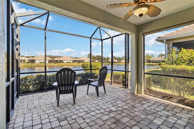 4891 Maymont Park Cir, Bradenton, FL 34203 - sunroom / solarium featuring a water view and ceiling fan