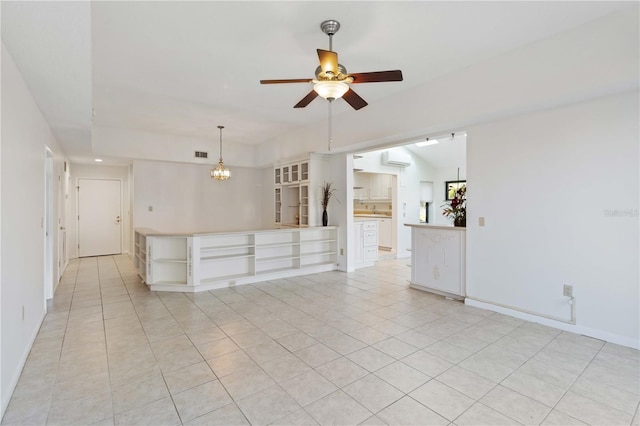 unfurnished living room with light tile patterned flooring, lofted ceiling, ceiling fan with notable chandelier, and a wall unit AC