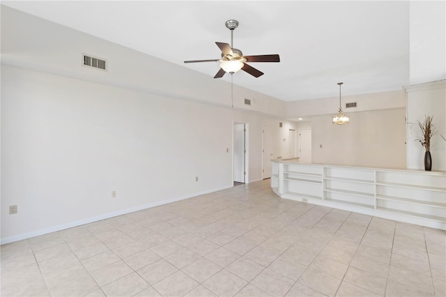 unfurnished living room with light tile patterned flooring and ceiling fan with notable chandelier