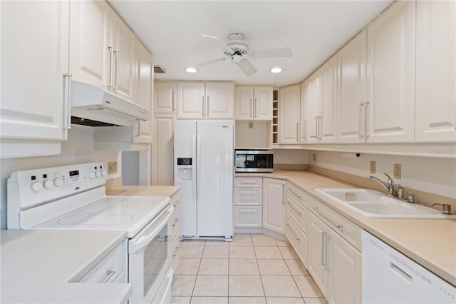 kitchen with sink, white cabinetry, white appliances, light tile patterned floors, and ceiling fan