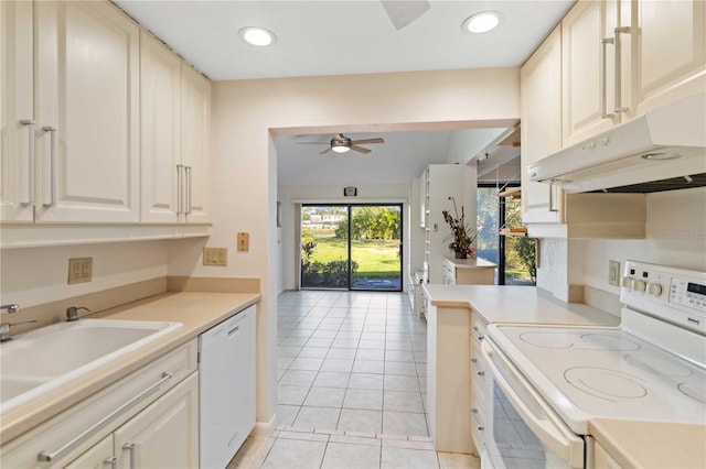 kitchen with ceiling fan, sink, light tile patterned floors, and white appliances