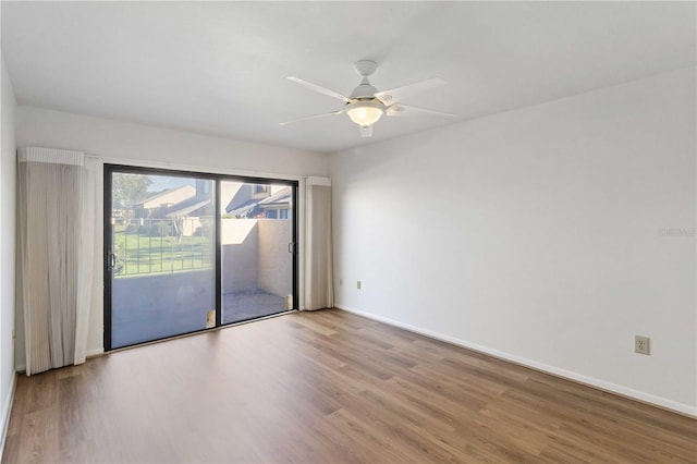 unfurnished room featuring ceiling fan and light hardwood / wood-style flooring