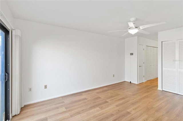 unfurnished bedroom featuring ceiling fan and light hardwood / wood-style floors