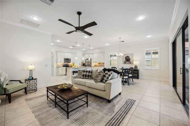 living room with light tile patterned floors, ornamental molding, visible vents, and recessed lighting