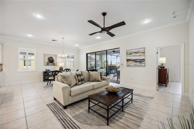 living area with a healthy amount of sunlight, light tile patterned floors, and crown molding