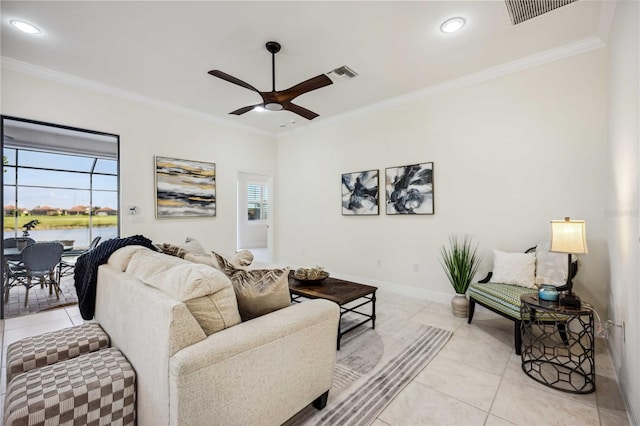 living room with plenty of natural light, visible vents, and crown molding