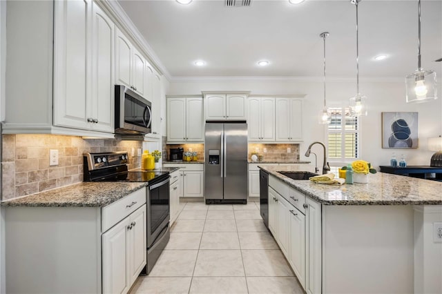 kitchen featuring hanging light fixtures, appliances with stainless steel finishes, ornamental molding, light tile patterned flooring, and a sink