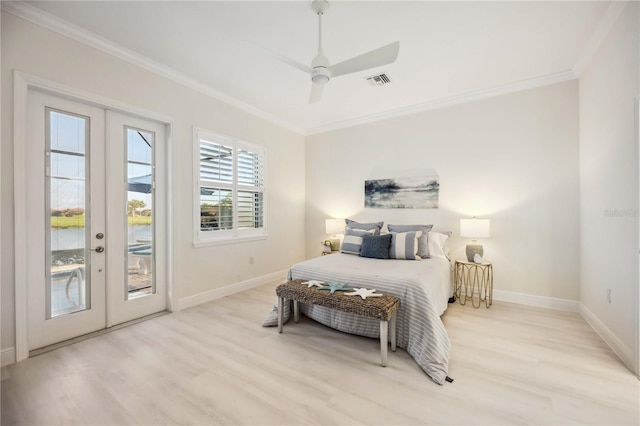 bedroom featuring access to exterior, french doors, visible vents, ornamental molding, and light wood-type flooring