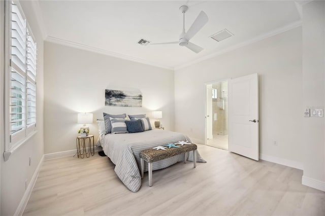 bedroom featuring ornamental molding, visible vents, light wood-style floors, and baseboards