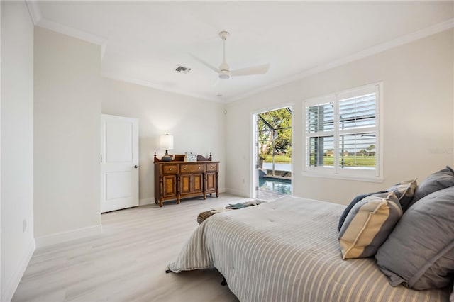 bedroom featuring visible vents, crown molding, light wood-style flooring, and baseboards