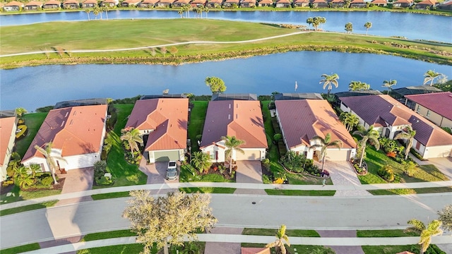 aerial view featuring a residential view and a water view