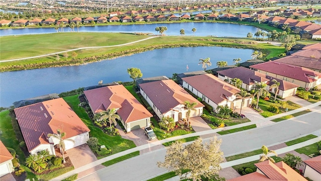 aerial view featuring a residential view and a water view