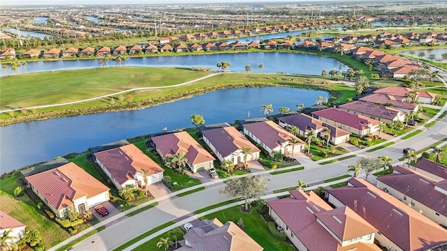 birds eye view of property with a residential view and a water view