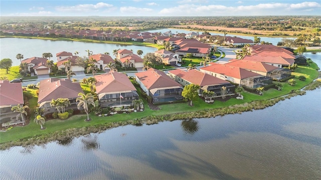 bird's eye view featuring a residential view and a water view