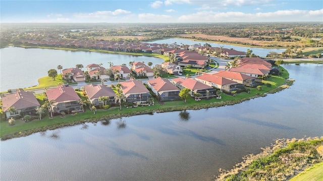 bird's eye view featuring a residential view and a water view