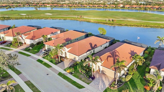 birds eye view of property featuring a water view, a residential view, and golf course view