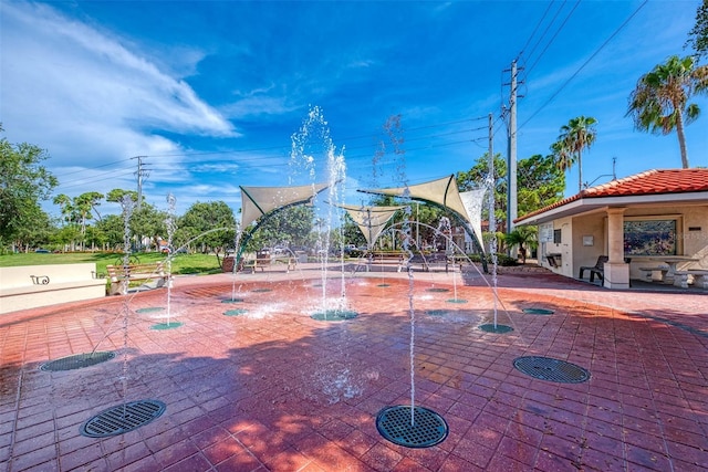 view of property's community featuring a patio area