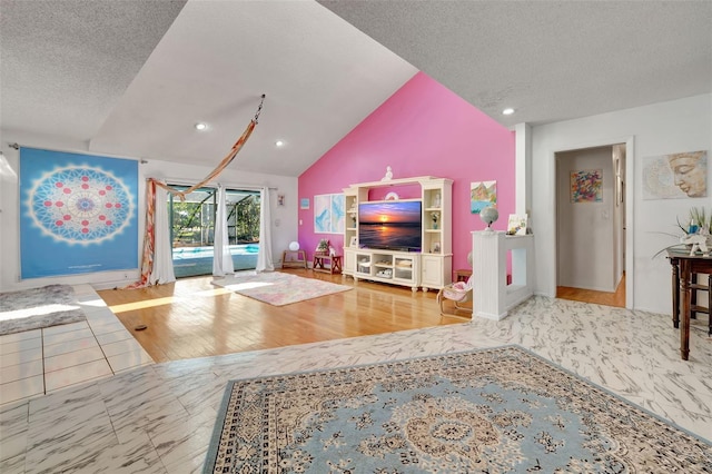 living room featuring lofted ceiling, marble finish floor, a textured ceiling, and recessed lighting