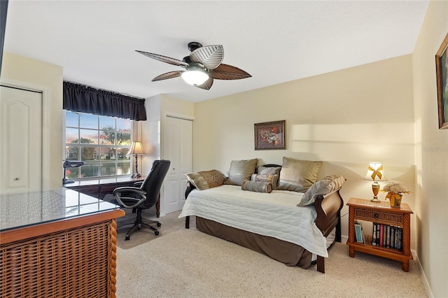 bedroom featuring light carpet and ceiling fan