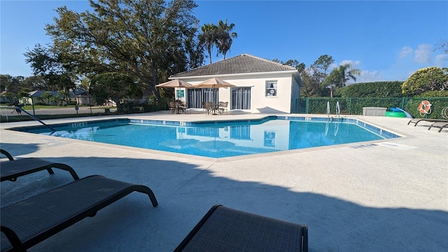 view of swimming pool with a patio