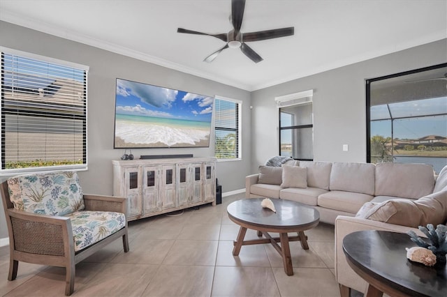 tiled living room featuring crown molding, a healthy amount of sunlight, and ceiling fan