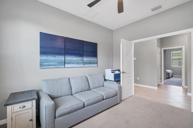 tiled living room featuring ceiling fan