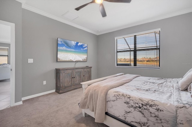 carpeted bedroom featuring ornamental molding and ceiling fan