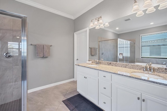 bathroom featuring ornamental molding, a shower with shower door, tile patterned flooring, and vanity