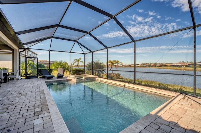 view of swimming pool featuring a water view, an in ground hot tub, a lanai, and a patio area