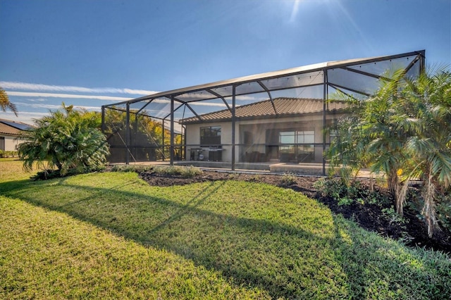 view of yard featuring glass enclosure