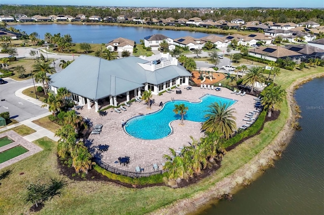 birds eye view of property featuring a water view