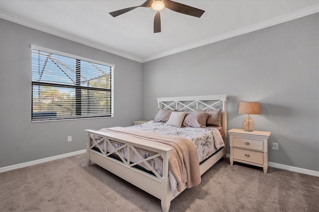 carpeted bedroom featuring ornamental molding and ceiling fan