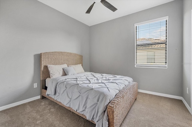 bedroom featuring ceiling fan and light carpet