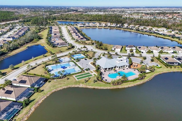 birds eye view of property with a water view