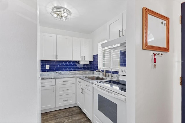 kitchen featuring sink, white range with electric cooktop, white cabinets, dark hardwood / wood-style flooring, and decorative backsplash