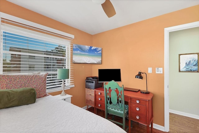 bedroom featuring dark wood-type flooring and ceiling fan