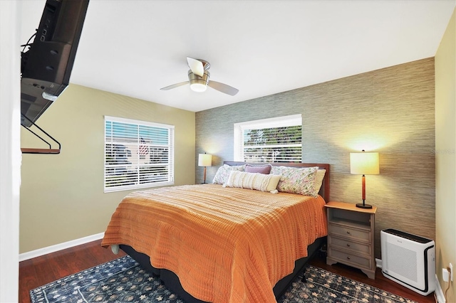 bedroom featuring dark hardwood / wood-style floors and ceiling fan