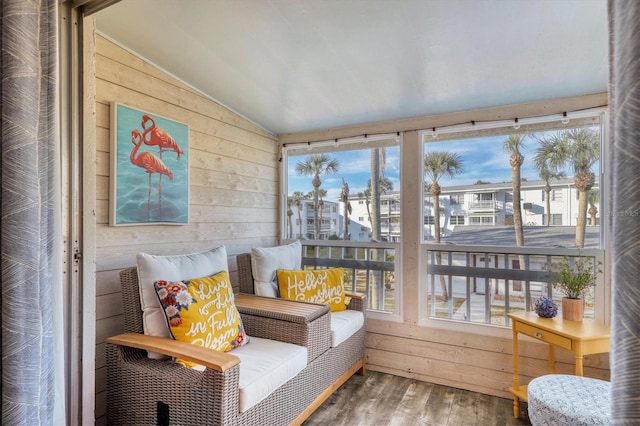 sunroom / solarium with vaulted ceiling