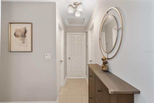 corridor with light tile patterned flooring