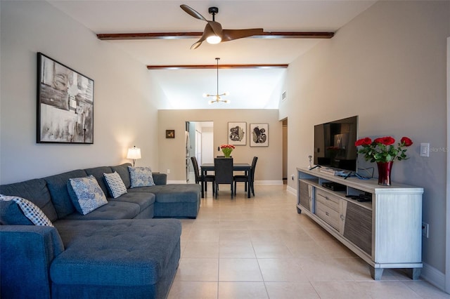 tiled living room featuring lofted ceiling with beams and ceiling fan with notable chandelier