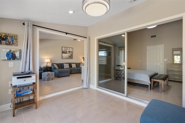 interior space featuring light tile patterned flooring and lofted ceiling