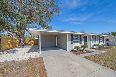 ranch-style house featuring a carport