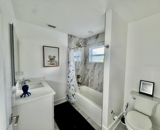 full bathroom featuring vanity, shower / bath combination with curtain, and toilet