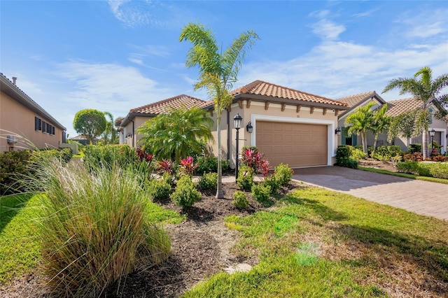 mediterranean / spanish-style house with a garage