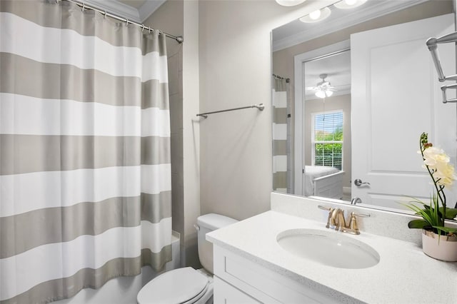 bathroom with crown molding, ceiling fan, vanity, and toilet