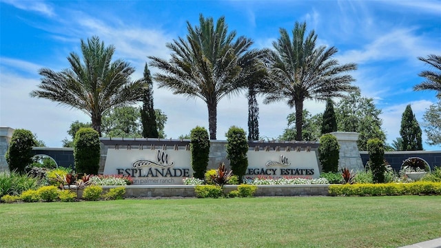 community / neighborhood sign with a yard