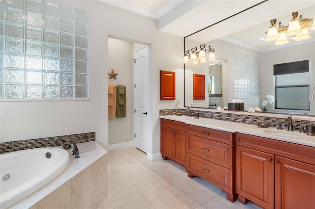 bathroom featuring tile patterned floors, crown molding, vanity, tiled bath, and backsplash