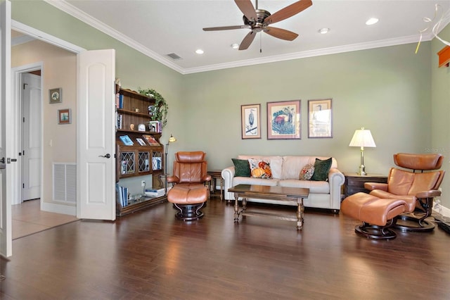 living room featuring crown molding, ceiling fan, and hardwood / wood-style flooring